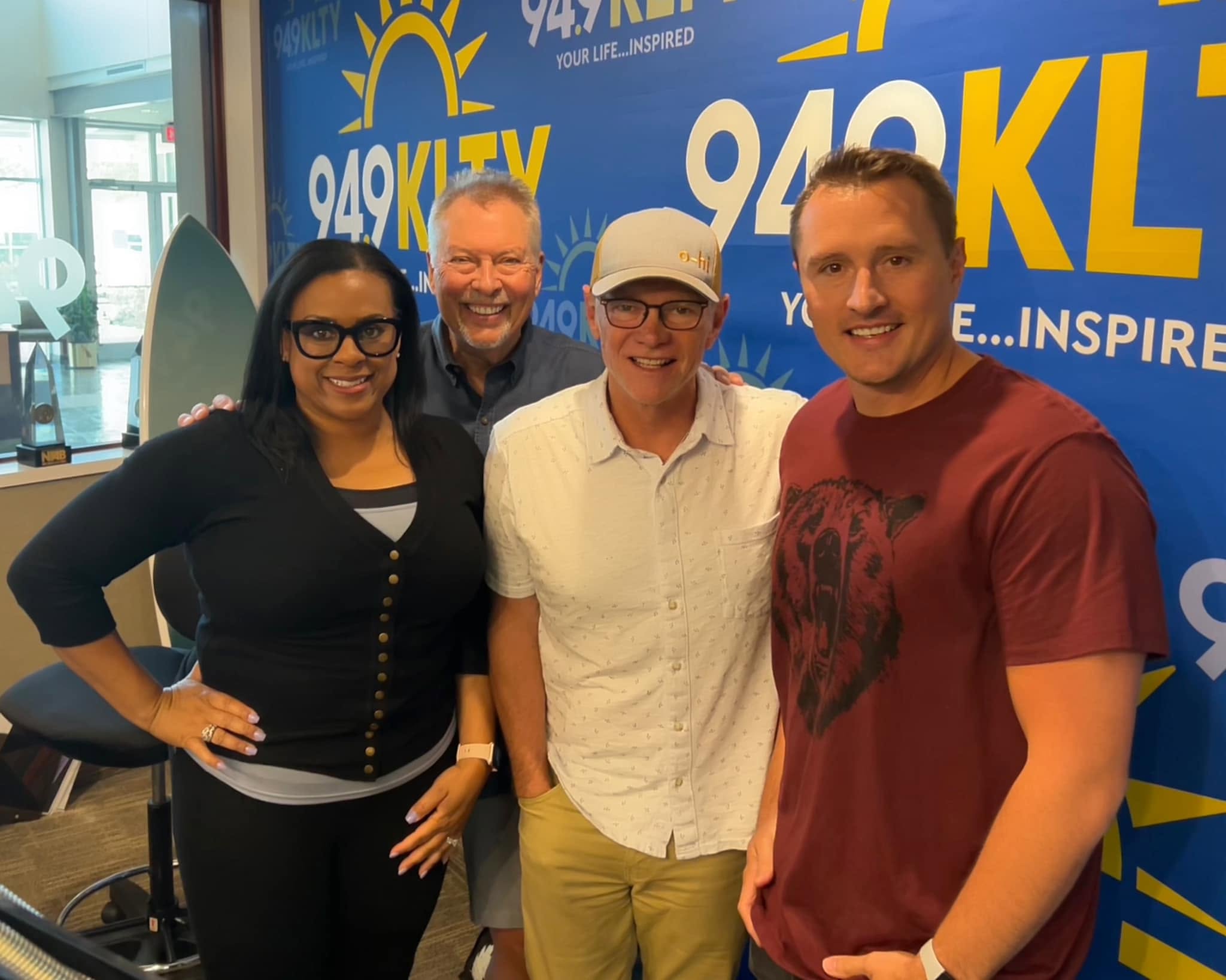 Frank Reed sharing a moment with a group at KLTY